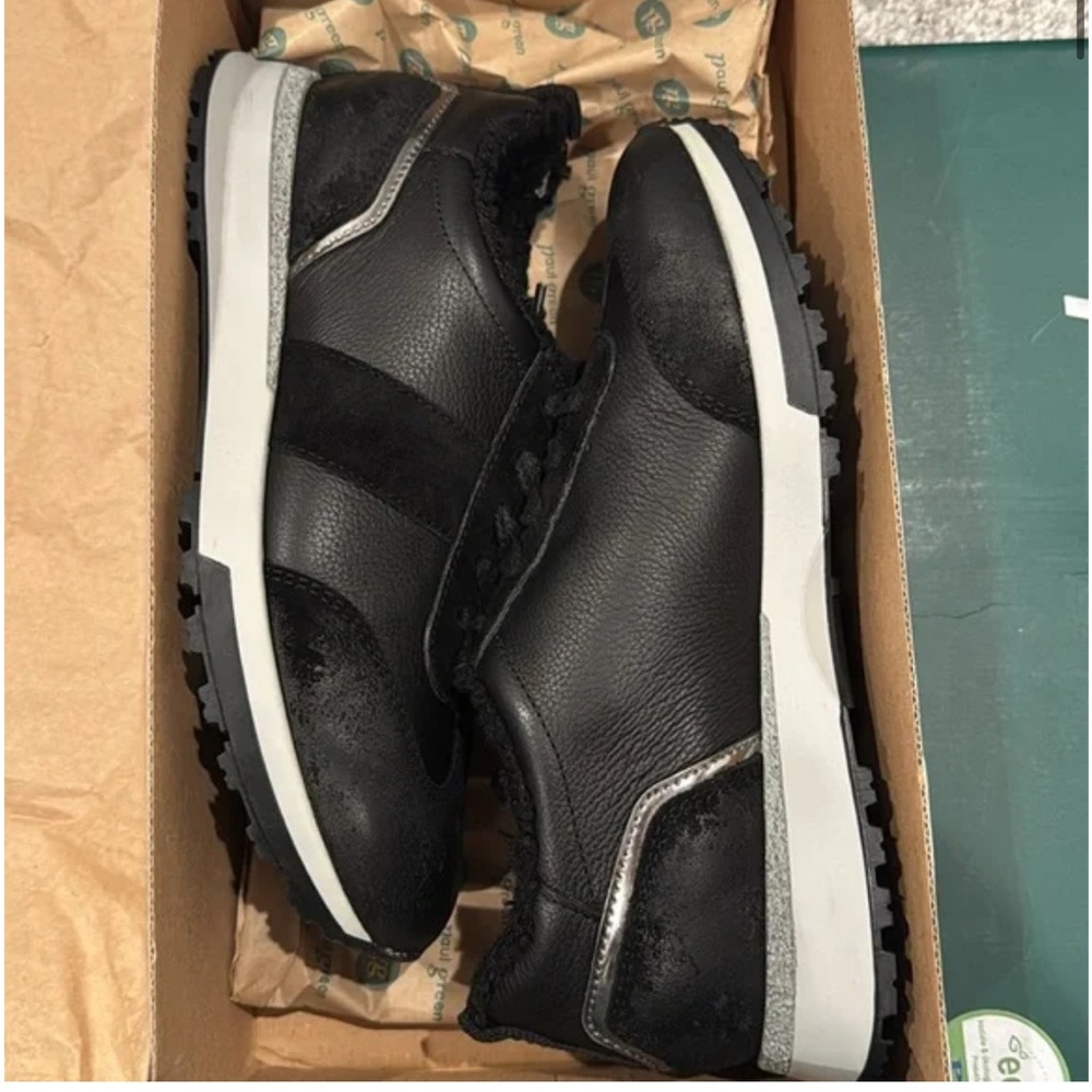 Black Leather Sneaker w/silver details and warm lining Women sizes. Never used